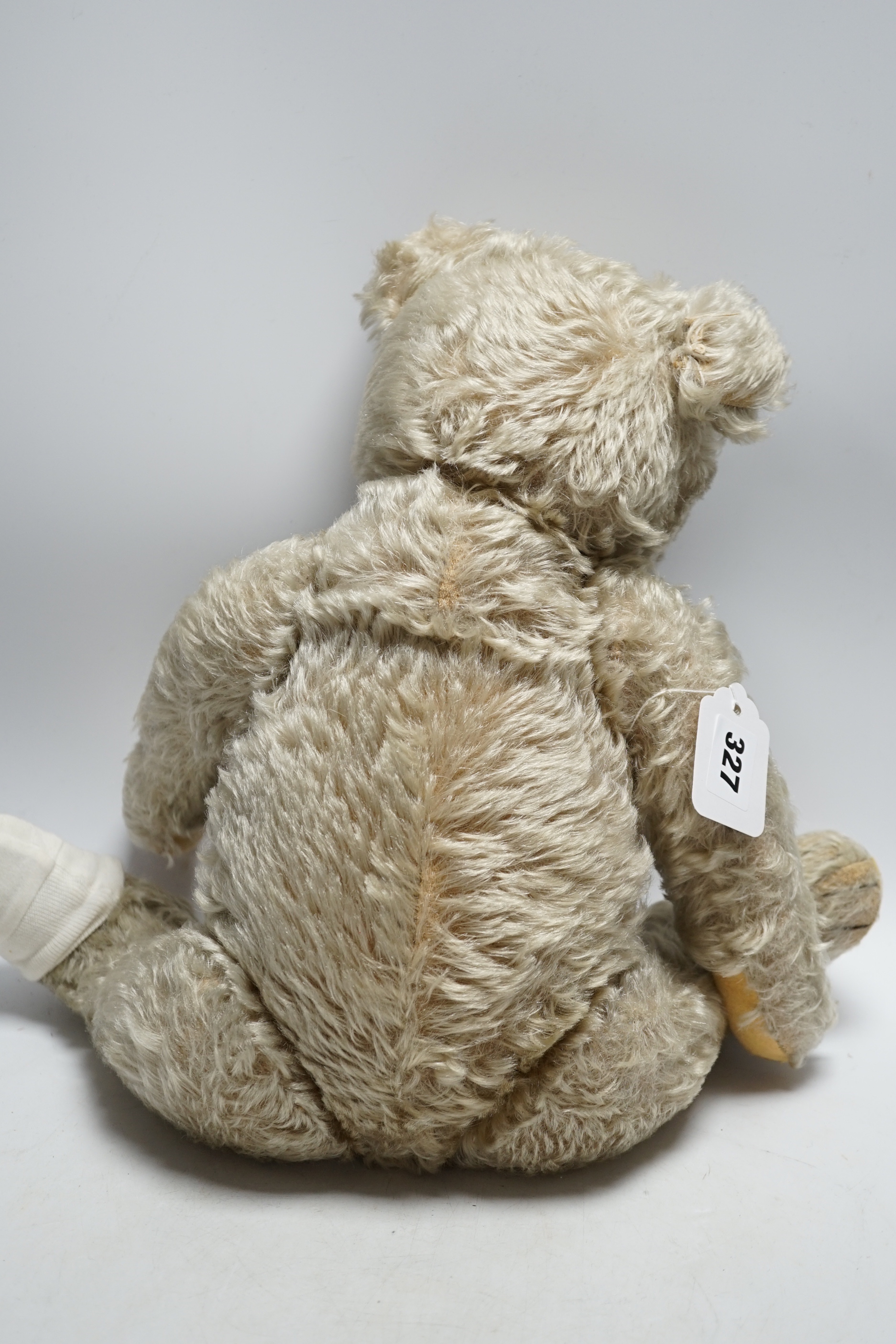 Steiff bear, c.1950's, button and label, 50cm, one ear loose, holes to paw pads, small patch of wear on chest